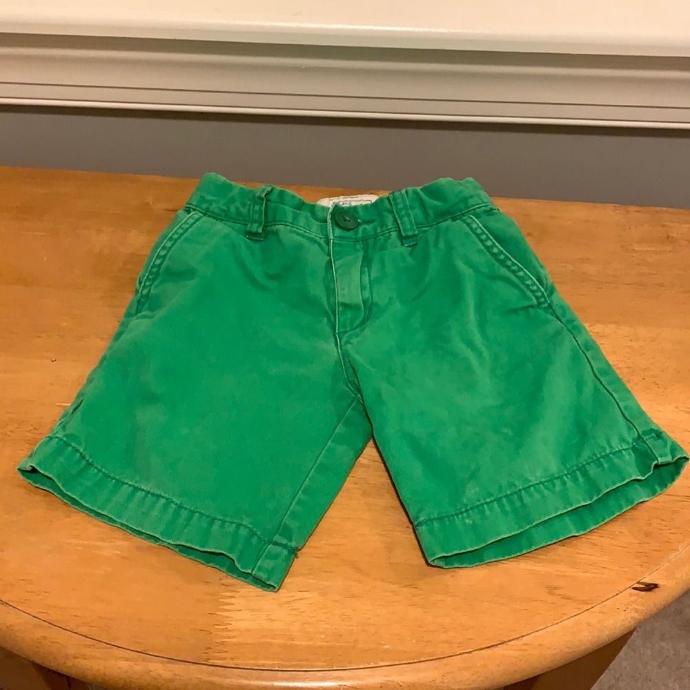 Children place, boy green shorts size 4